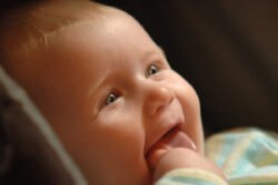 Baby with big smile with black background